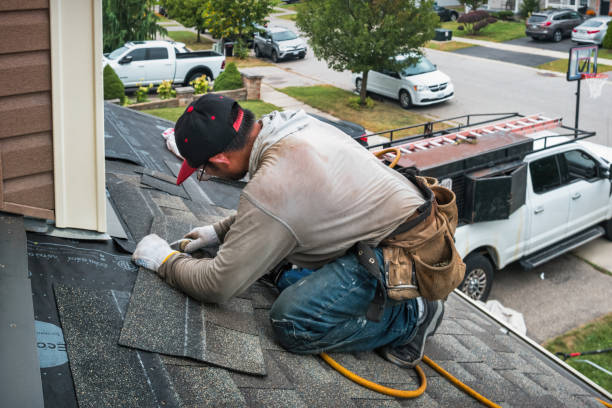 Professional Roof Replacement technician working in Yates City, IL